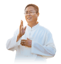 a chinese man in a white robe clapping his hands